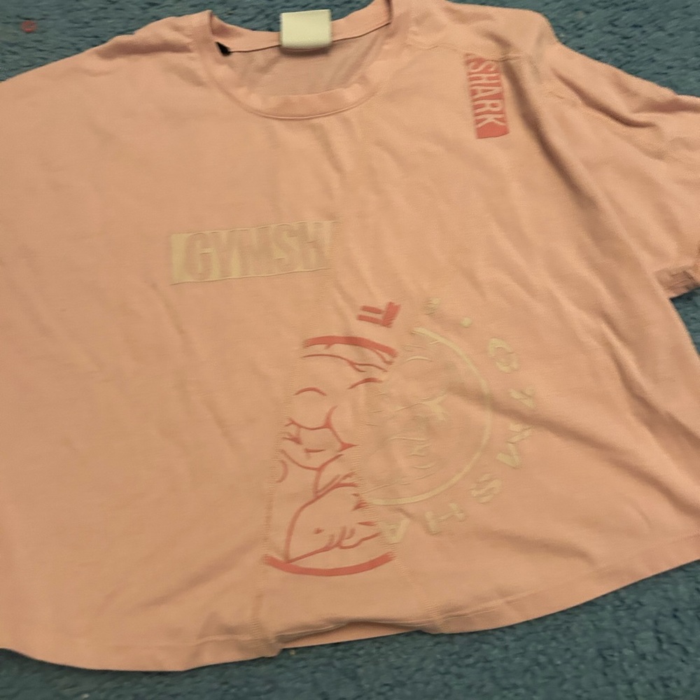 pink gym shark workout shirt. selling just because i don’t wear it any what